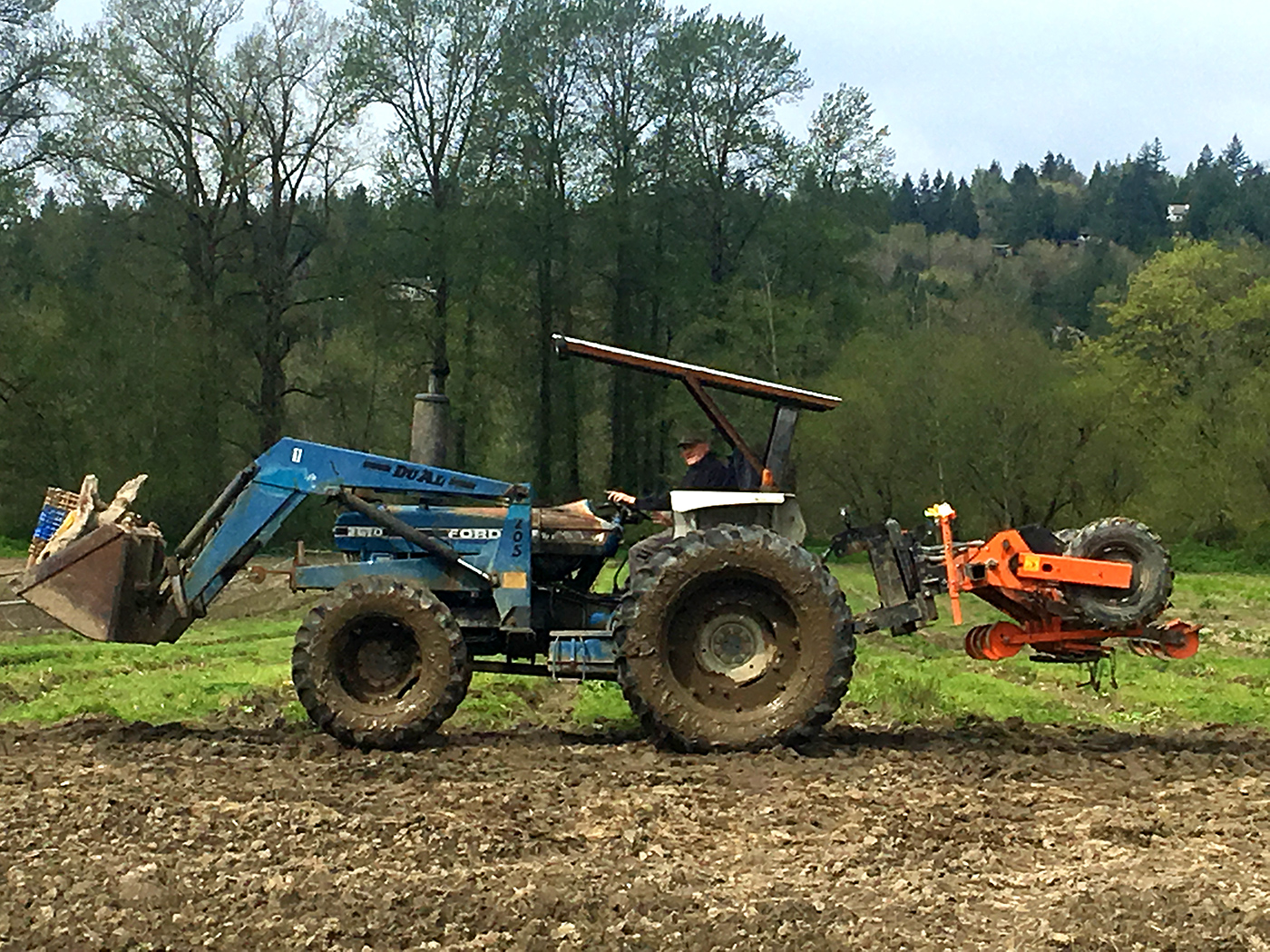 organic farmer on tractor